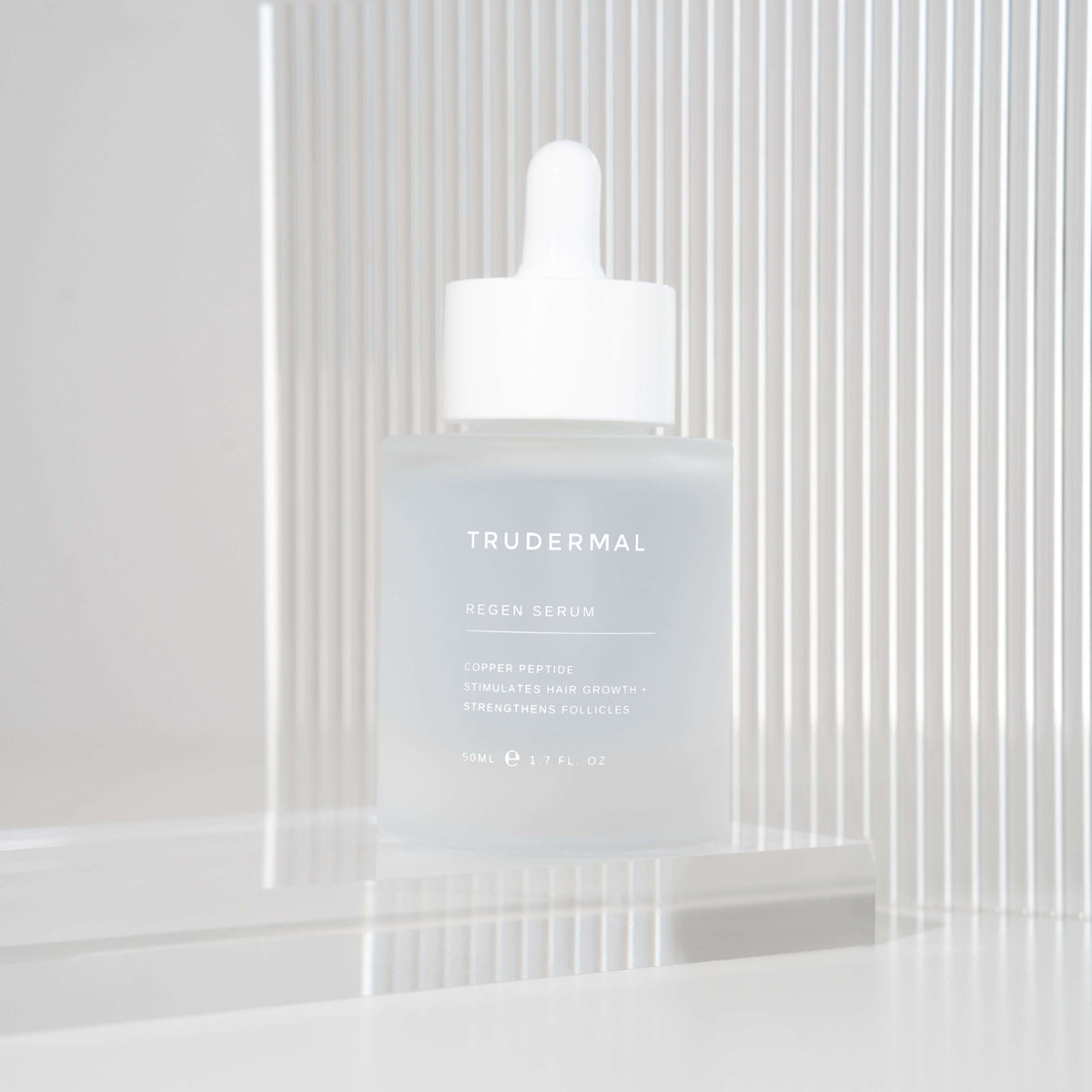 Trudermal Regen hair growth serum designed to strengthen strands and improve hair density.